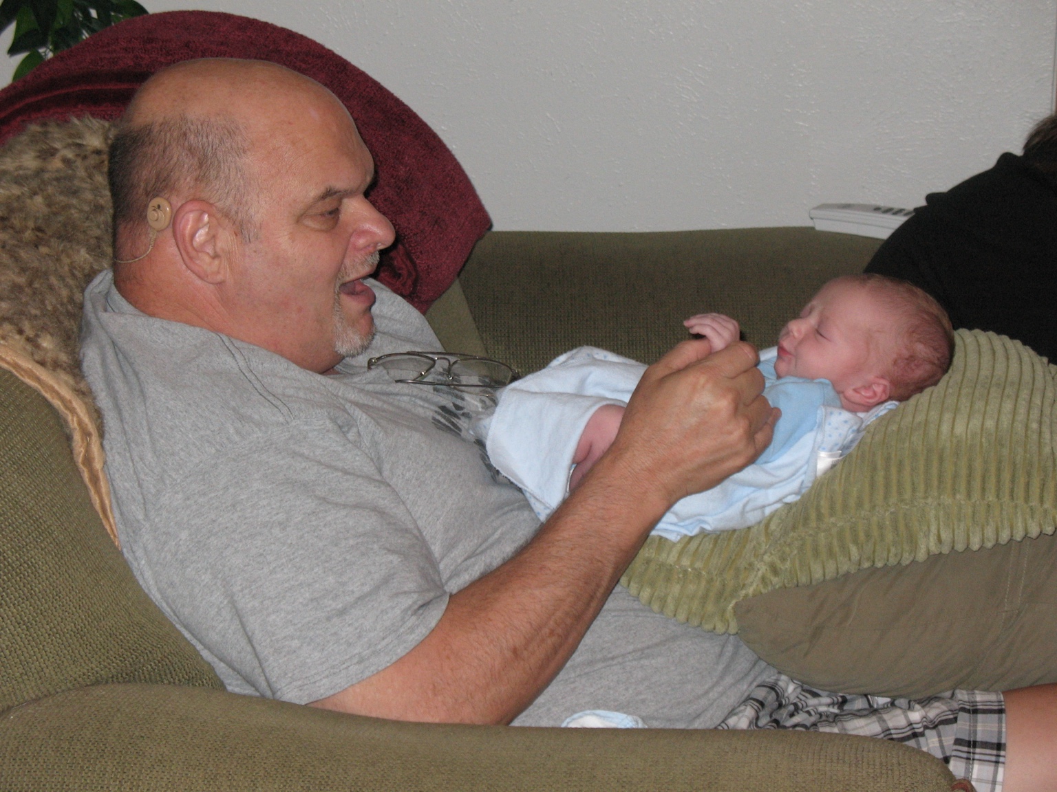 Memory photo of Jim holding a baby